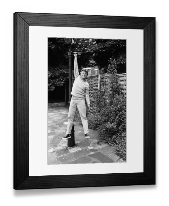 Framed Print : President of Bermondsey Boat Club Tommy Steele relaxes at his Thames side house