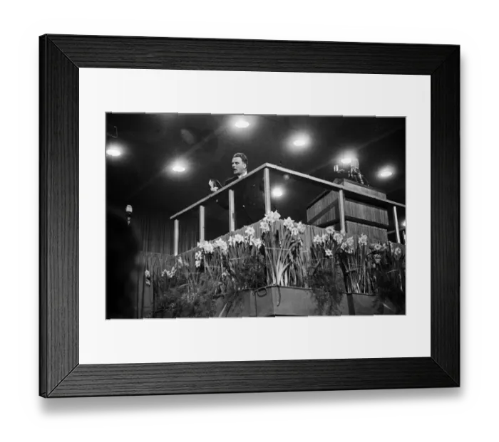Framed Print : American evangelist Billy Graham addressing a huge crowd of people at Kelvin Hall in