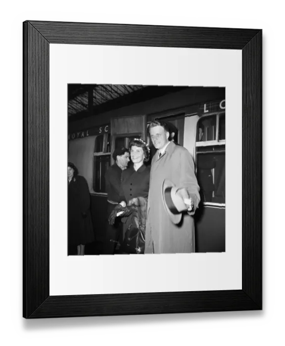 Framed Print : American evangelist Billy Graham arrives with his wife Ruth at Euston Station in London Framed Print : American evangelist Billy Graham arrives with his wife Ruth at Euston Station in London
