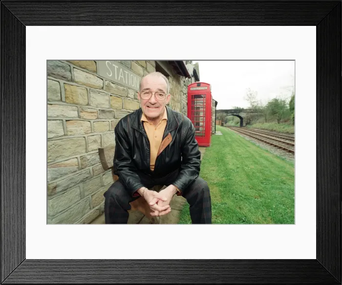 Framed Print : Jim Bowen by the railway which passes by his house in Arkholme, Lancashire