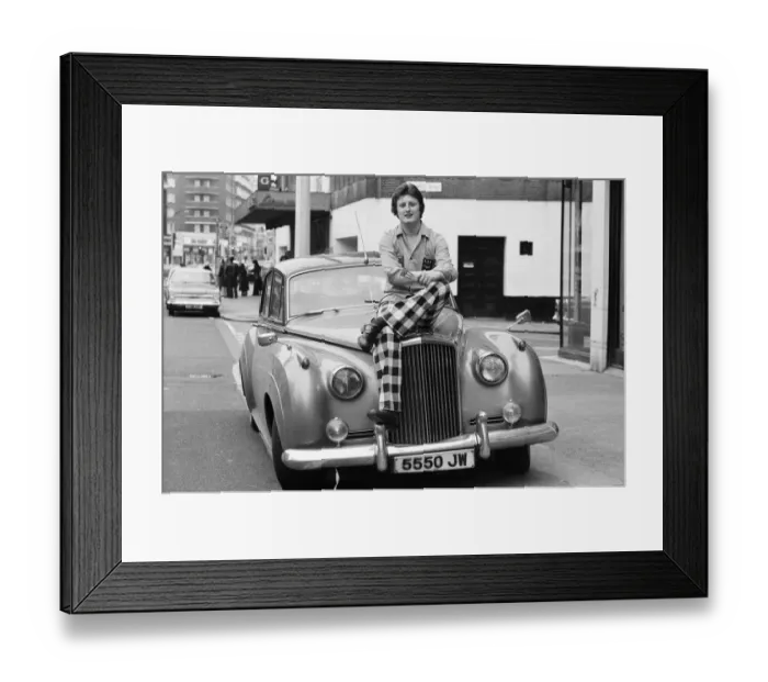 Framed Print : Nineteen year old dart player Eric Bristow poses in London sitting on top of a Rolls Framed Print : Nineteen year old dart player Eric Bristow poses in London sitting on top of a Rolls