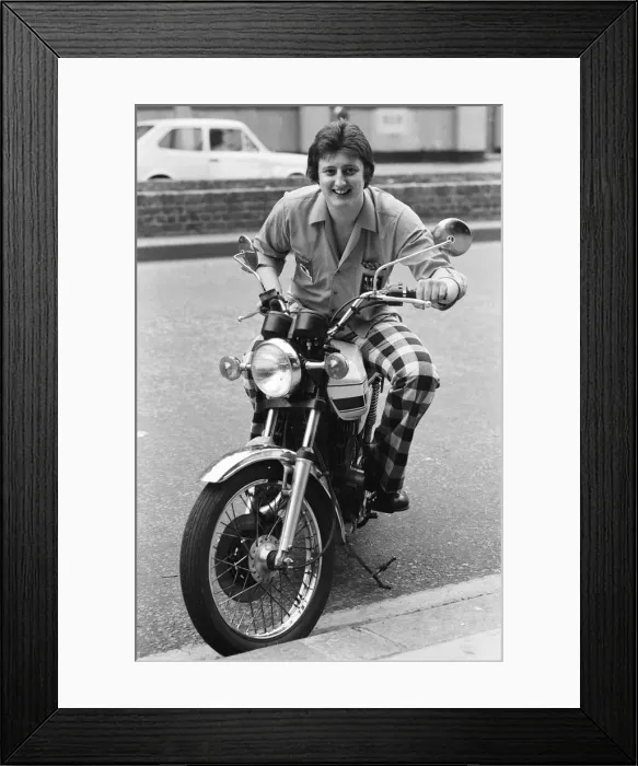 Framed Print : Nineteen year old dart player Eric Bristow poses in London sitting on a motorbike Framed Print : Nineteen year old dart player Eric Bristow poses in London sitting on a motorbike