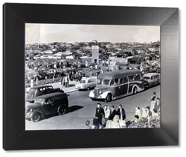 Barry Island - Car parks full as people, cars and buses flock to the beach. c. July 1959