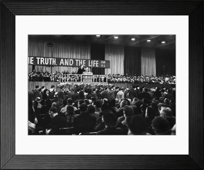 Framed Print : American evangelist Billy Graham addressing a huge crowd of people at Kelvin Hall in