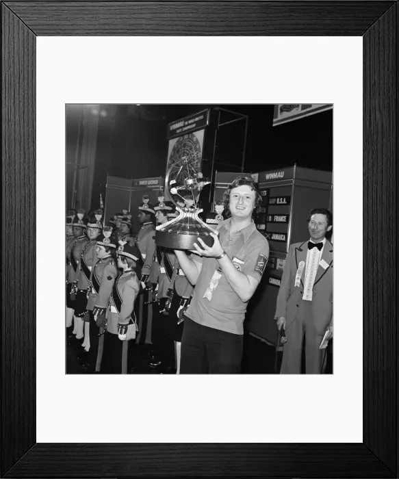 Framed Print : British dart player Eric Bristow holds aloft the trophy after winning the Worlds Masters Framed Print : British dart player Eric Bristow holds aloft the trophy after winning the Worlds Masters