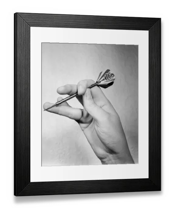 Framed Print : Close up feature on British darts player Eric Bristow in dart throwing action Framed Print : Close up feature on British darts player Eric Bristow in dart throwing action