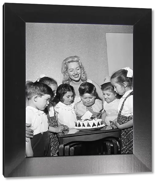 Sheree Winton, her son Dale Winton (centre looking over his cake)