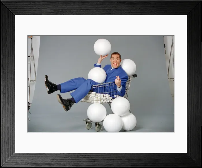 Framed Print : Dale Winton, TV presenter, poses for a studio photoshoot to celebrate his hosting of