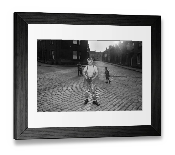 Framed Print : Seventeen year old skinhead teenager Janet Askham poses in the street at her home in