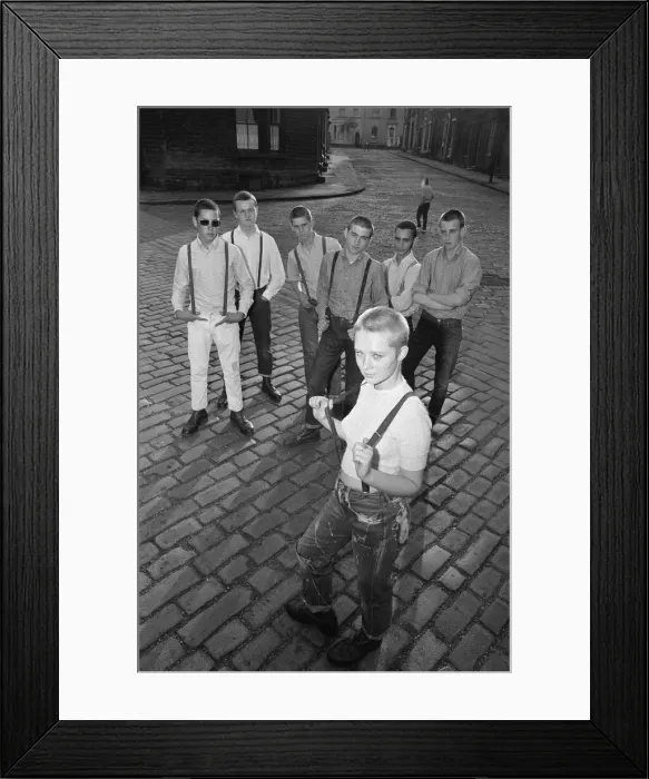 Framed Print : Seventeen year old skinhead teenager Janet Askham poses in the street at her home in Framed Print : Seventeen year old skinhead teenager Janet Askham poses in the street at her home in