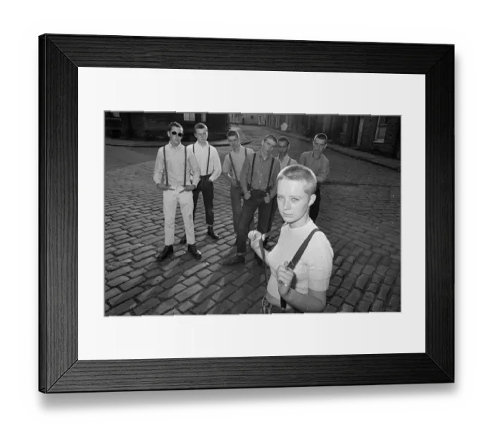 Framed Print : Seventeen year old skinhead teenager Janet Askham poses with her friends at her home in