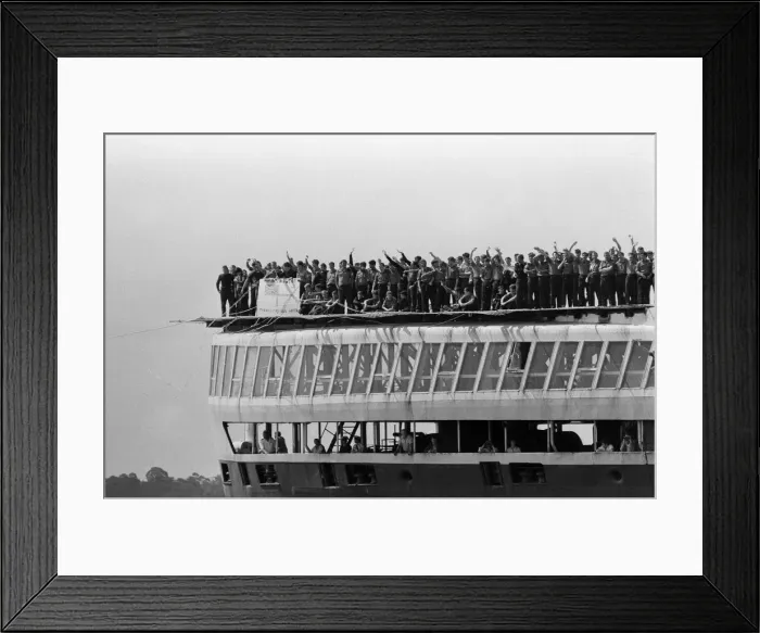 Framed Print : QE2 returns home to Southampton. Union Jacks are festooned on cars, draped on shoulders Framed Print : QE2 returns home to Southampton. Union Jacks are festooned on cars, draped on shoulders