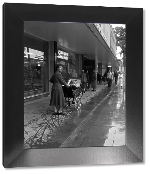 Stevenage New Town, Hertfordshire, where shoppers walk in the shelter of canopies