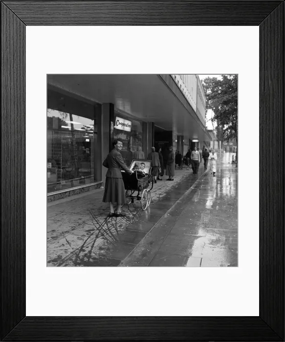 Framed Print : Stevenage New Town, Hertfordshire, where shoppers walk in the shelter of canopies Framed Print : Stevenage New Town, Hertfordshire, where shoppers walk in the shelter of canopies