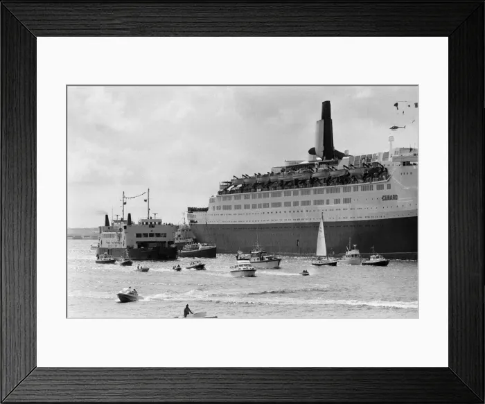 Framed Print : QE2 returns home to Southampton. Union Jacks are festooned on cars, draped on shoulders Framed Print : QE2 returns home to Southampton. Union Jacks are festooned on cars, draped on shoulders