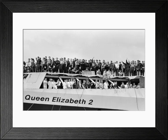 Framed Print : QE2 returns home to Southampton. Union Jacks are festooned on cars, draped on shoulders Framed Print : QE2 returns home to Southampton. Union Jacks are festooned on cars, draped on shoulders