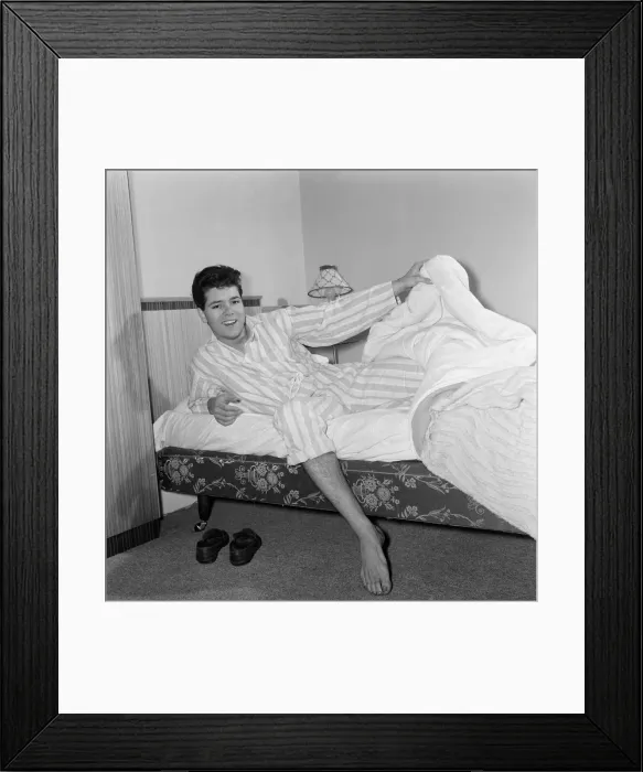 Framed Print : Teenage pop idol Cliff Richard relaxes on his divan at his Winchmore Hill home