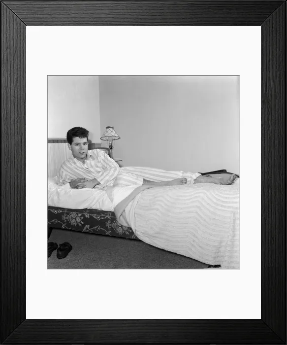 Framed Print : Teenage pop idol Cliff Richard relaxes on his divan at his Winchmore Hill home Framed Print : Teenage pop idol Cliff Richard relaxes on his divan at his Winchmore Hill home