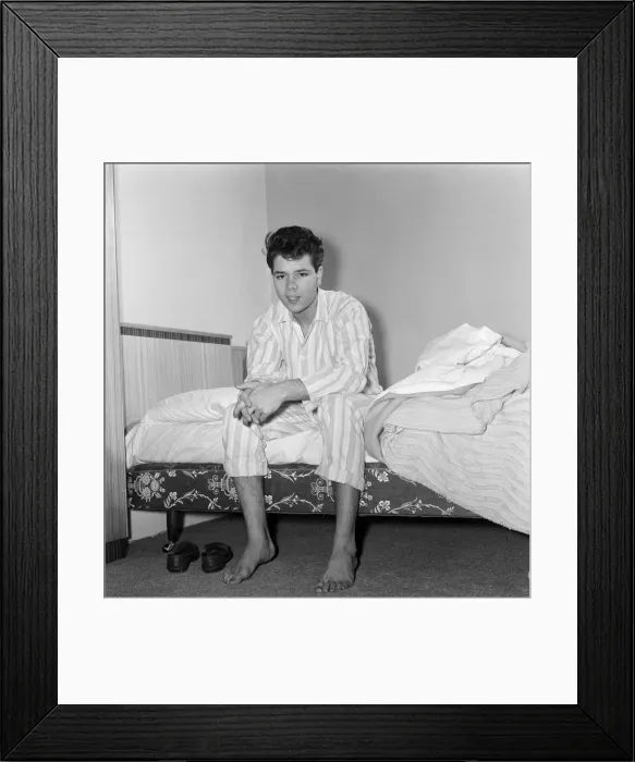 Framed Print : Teenage pop idol Cliff Richard relaxes on his divan at his Winchmore Hill home Framed Print : Teenage pop idol Cliff Richard relaxes on his divan at his Winchmore Hill home
