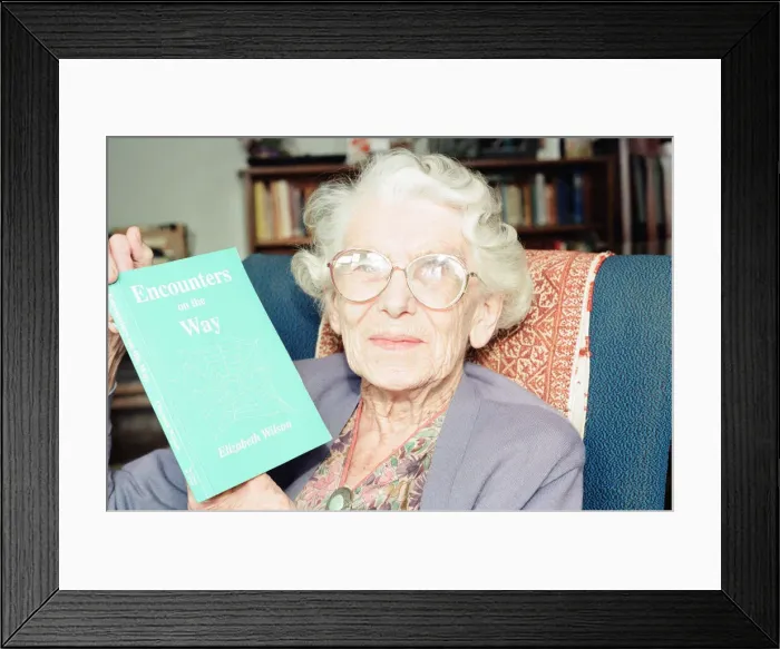 Framed Print : Elizabeth Wilson, Author with a copy of her book, Encounters on the Way, Circa 1998 Framed Print : Elizabeth Wilson, Author with a copy of her book, Encounters on the Way, Circa 1998
