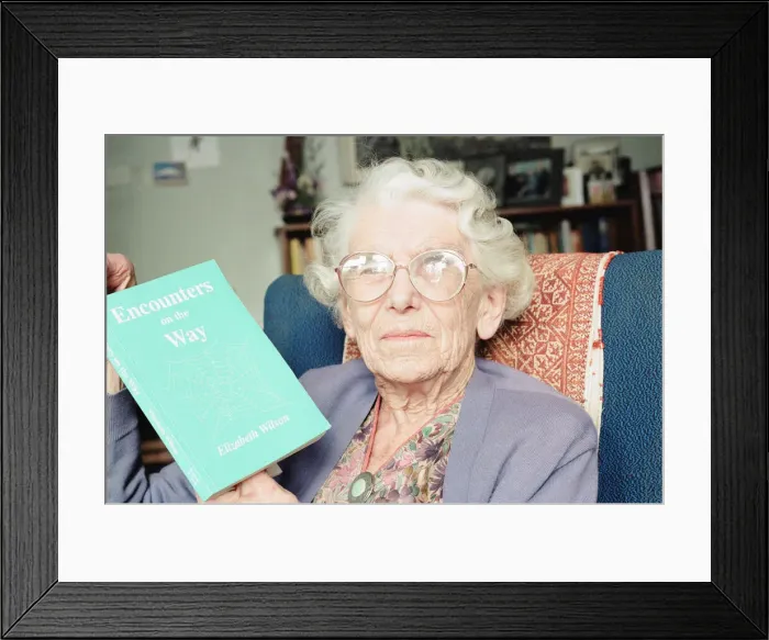 Framed Print : Elizabeth Wilson, Author with a copy of her book, Encounters on the Way, Circa 1998 Framed Print : Elizabeth Wilson, Author with a copy of her book, Encounters on the Way, Circa 1998