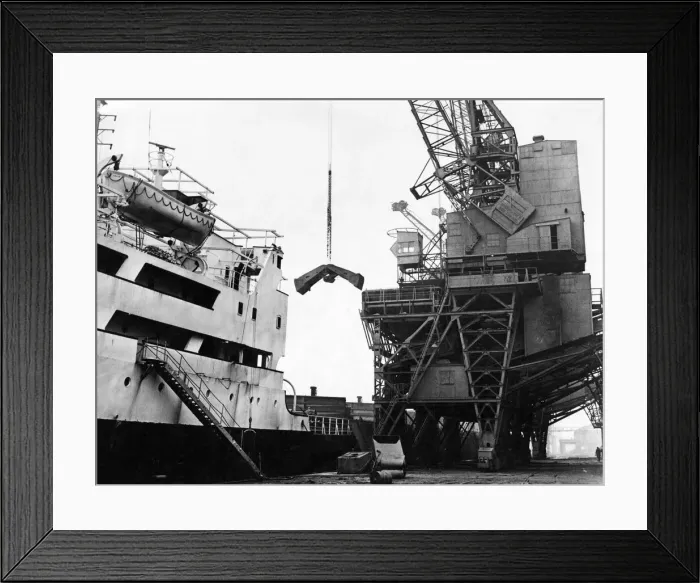 Framed Print : Working at full pressure, another ship is unloaded of it Framed Print : Working at full pressure, another ship is unloaded of it