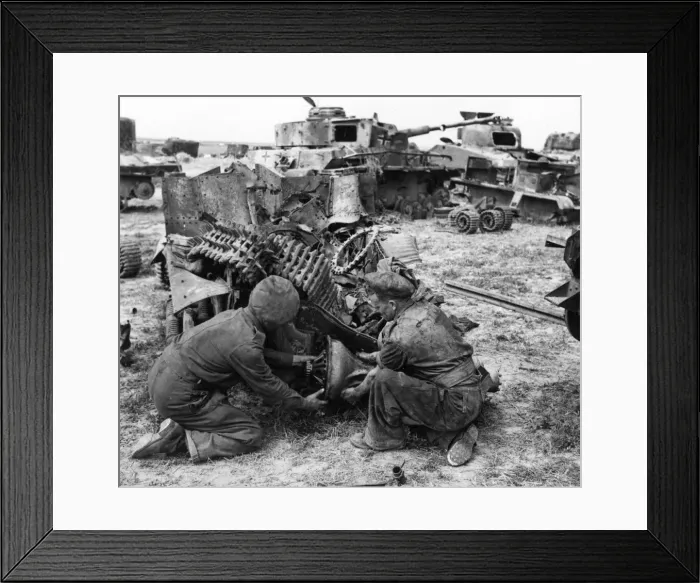 Framed Print : British army engineers remove the bearing from a wrecked vehicle in a dump which has
