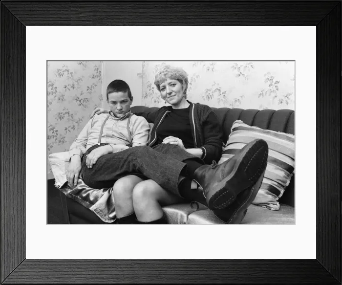 Framed Print : Fifteen year old skinhead Chris Harward poses at home with his mother Joan at their flat