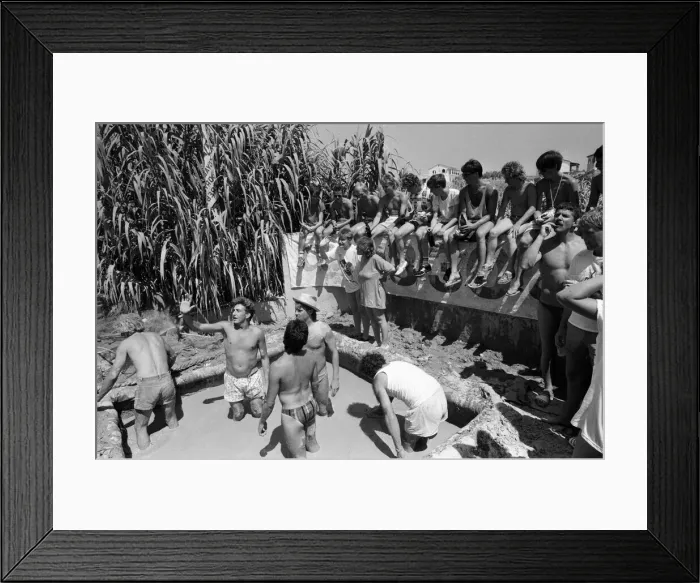 Framed Print : Young people on holiday in Corfu on a Club 18-30 holiday. Young people wrestle in the mud Framed Print : Young people on holiday in Corfu on a Club 18-30 holiday. Young people wrestle in the mud