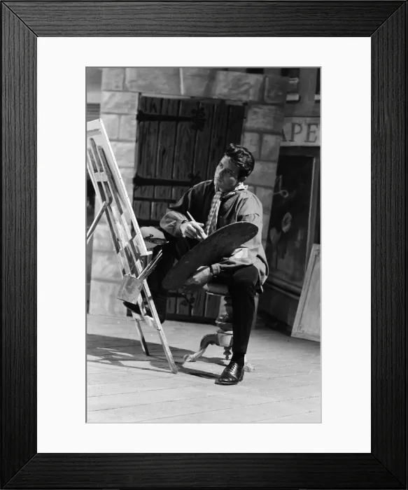 Framed Print : Cliff Richard on the set of the film Summer Holiday, painting with a brush and easel Framed Print : Cliff Richard on the set of the film Summer Holiday, painting with a brush and easel