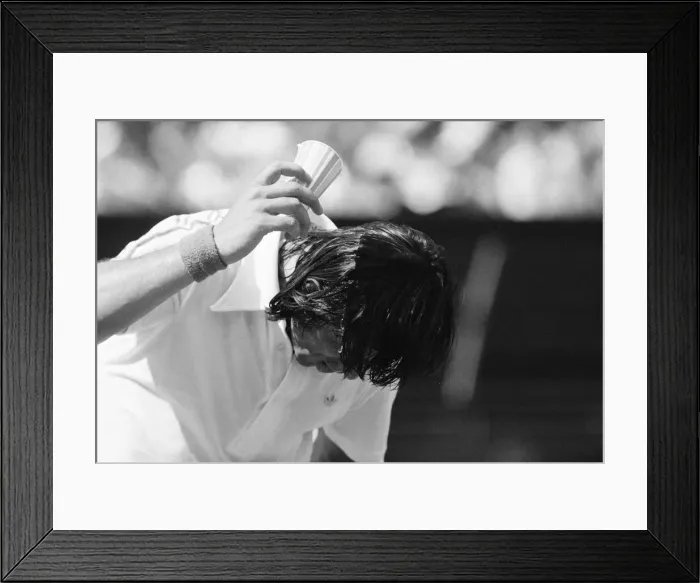 Framed Print : Ilie Nastase, Romanian Tennis Player, feels the heat at Wimbledon Tennis Championships Framed Print : Ilie Nastase, Romanian Tennis Player, feels the heat at Wimbledon Tennis Championships