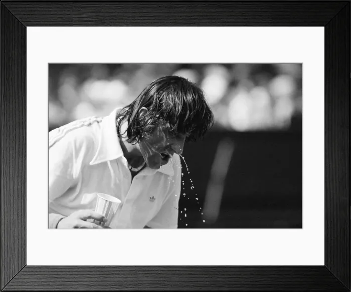 Framed Print : Ilie Nastase, Romanian Tennis Player, feels the heat at Wimbledon Tennis Championships Framed Print : Ilie Nastase, Romanian Tennis Player, feels the heat at Wimbledon Tennis Championships