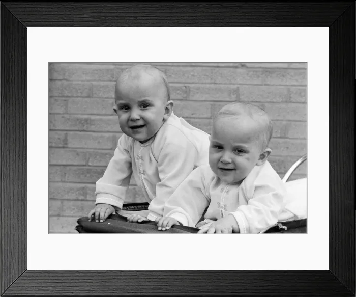 Framed Print : Twin sisters Anna (right) and Barbara Rozycki, at home in Coventry