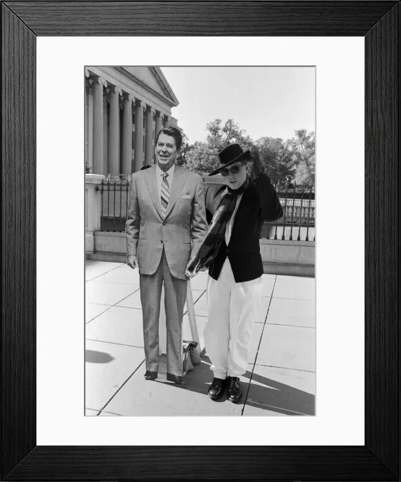 Framed Print : Holly Johnson posing outside the White House with a full-size cutout of Ronald Reagan Framed Print : Holly Johnson posing outside the White House with a full-size cutout of Ronald Reagan