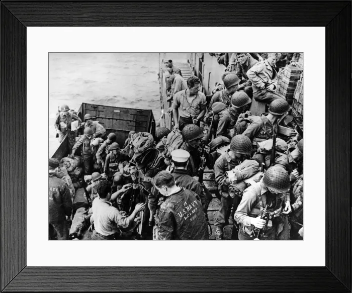 Framed Print : Climbing out of an LCVP (Landing Craft, Vehicle Personnel) U