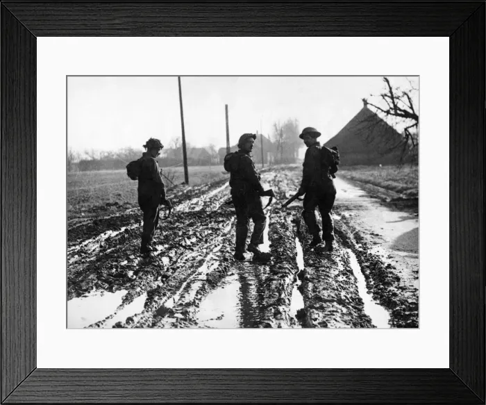 Framed Print : British army soldiers making their way up to the front line in Holland through deep mud