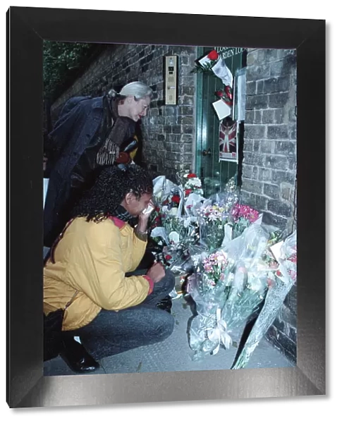Fans gather outside the Kensington, West London, home of singer Freddie Mercury who died