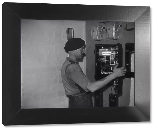 Bilston Pottery 1958 A worker inspects the controls for the electrical operated