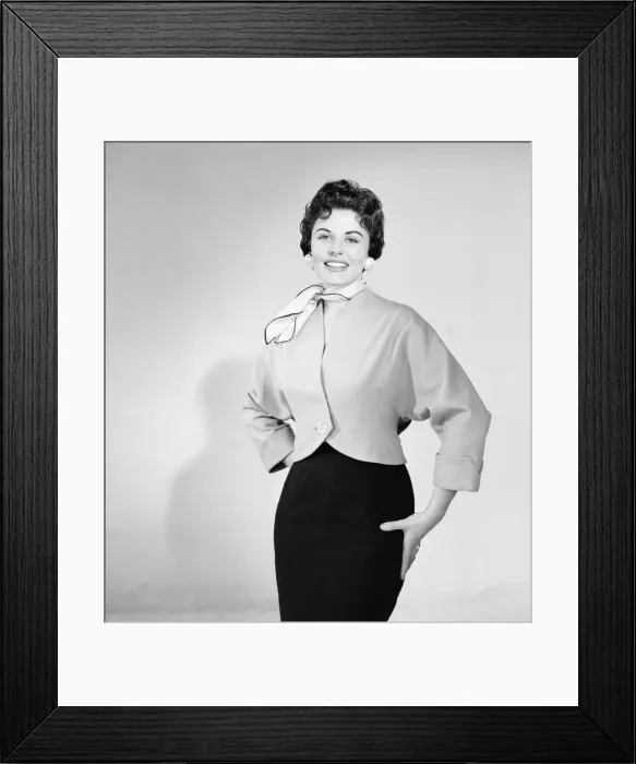 Framed Print : Eunice Gayson, actress and model, poses in a jacket for Sunday Mirror Promotion
