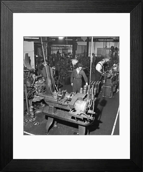 Framed Print : Mass production in the machine shop of small components for the mining industry