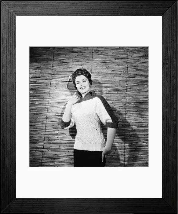 Framed Print : Eunice Gayson, actress and model, poses in a sweater for Sunday Mirror Promotion Framed Print : Eunice Gayson, actress and model, poses in a sweater for Sunday Mirror Promotion