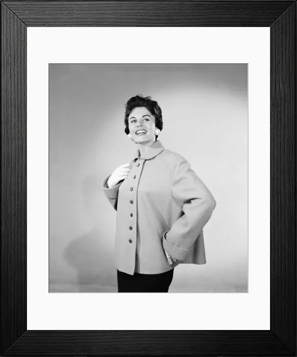 Framed Print : Eunice Gayson, actress and model, poses in a jacket for Sunday Mirror Promotion Framed Print : Eunice Gayson, actress and model, poses in a jacket for Sunday Mirror Promotion
