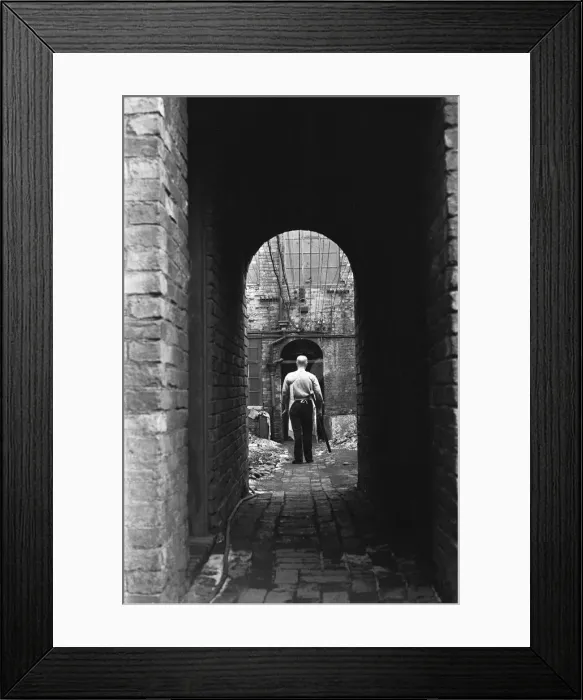 Framed Print : Gunsmith taking a pair of shotguns to the Gun Barrel Proof House