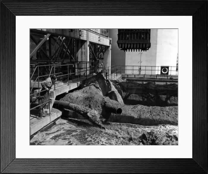 Framed Print : One of the employees at the Aberthaw power station watched the used ash mixed with water Framed Print : One of the employees at the Aberthaw power station watched the used ash mixed with water