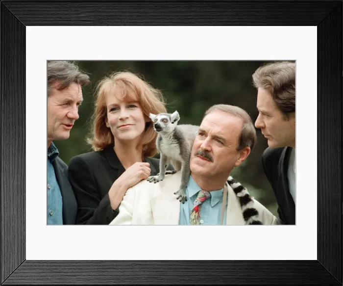 Framed Print : Jamie Lee Curtis, John Cleese (centre in the white jacket and jeans)