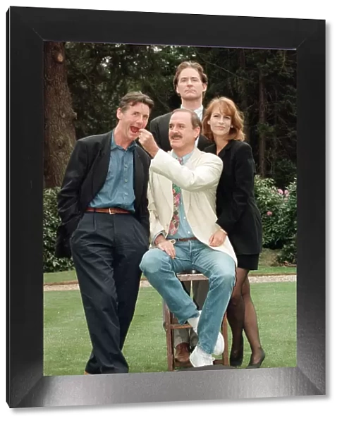 Jamie Lee Curtis, John Cleese (centre in the white jacket and jeans)