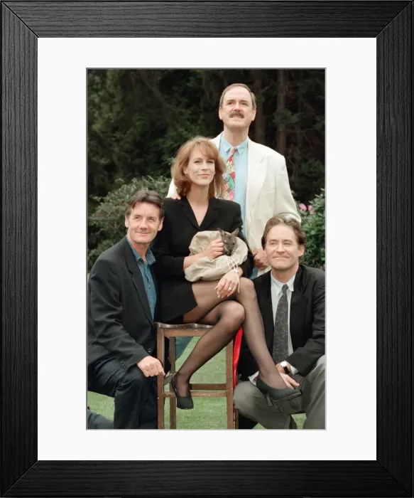 Framed Print : Jamie Lee Curtis, John Cleese (behind in the white jacket and jeans)