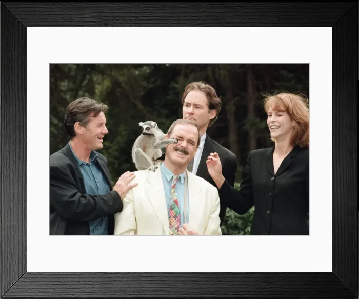 Framed Print : Jamie Lee Curtis, John Cleese (centre in the white jacket and jeans)
