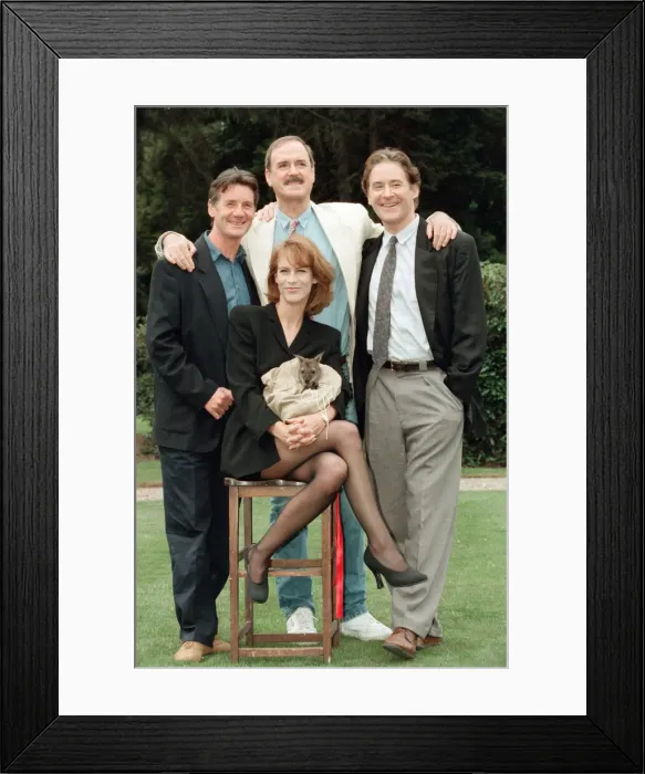 Framed Print : Jamie Lee Curtis, John Cleese (behind in the white jacket and jeans) Framed Print : Jamie Lee Curtis, John Cleese (behind in the white jacket and jeans)