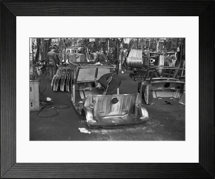 Framed Print : Austin Mini body panels are assembled prior to welding and being placed on the production Framed Print : Austin Mini body panels are assembled prior to welding and being placed on the production